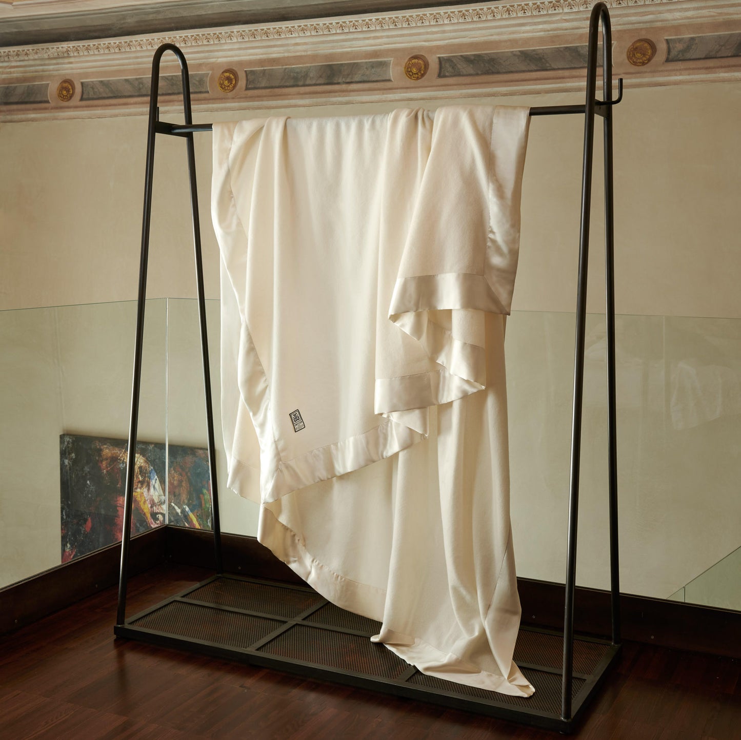 Hollywood Ava Luxury Cashmere Blanket with Lambswool blend having on a blanket hangar in a beautiful house.